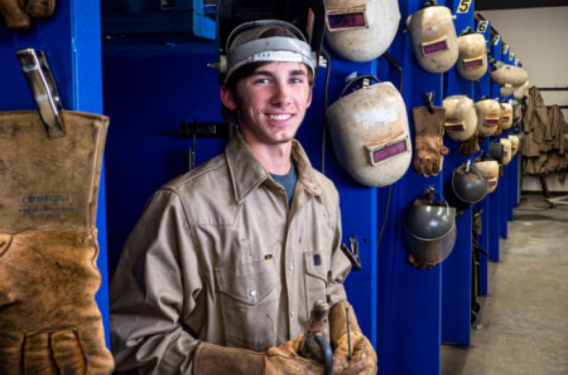 Young man in welding apparel